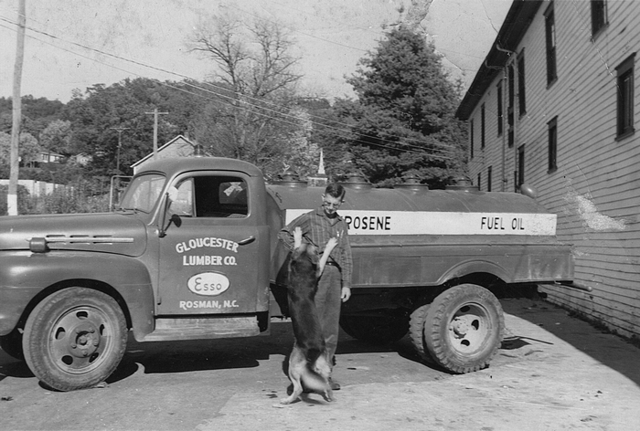 Rosman Company Store driver Buck Owen in front of oil truck